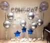 Graduation setup of chrome and confetti balloons