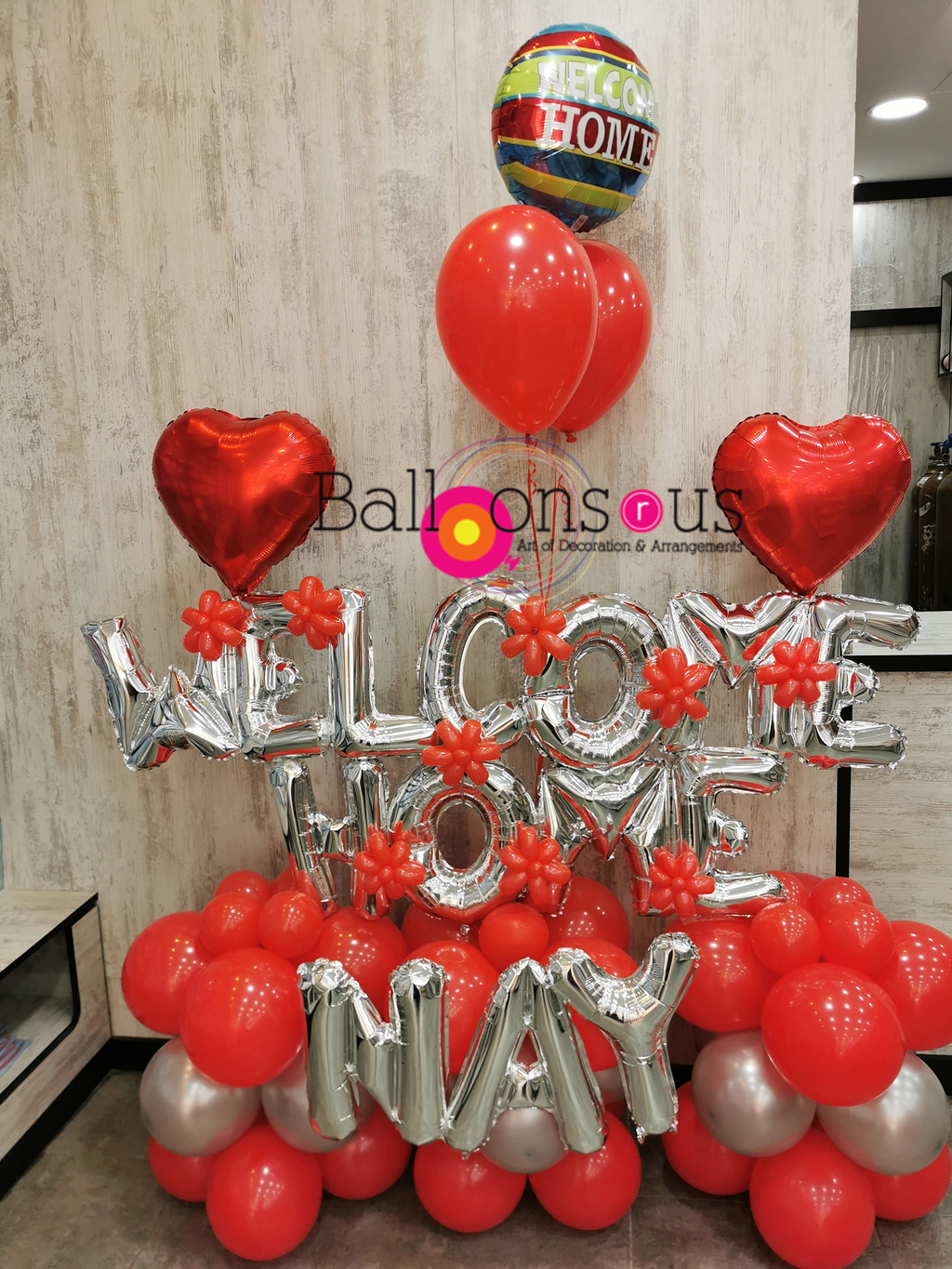 Welcome Home with heart balloons